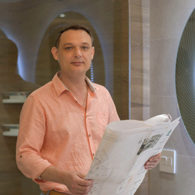 Dmitriy Skorozhenko reviewing interior project plans