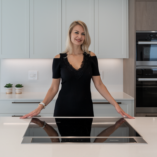 Katya in her completed kitchen