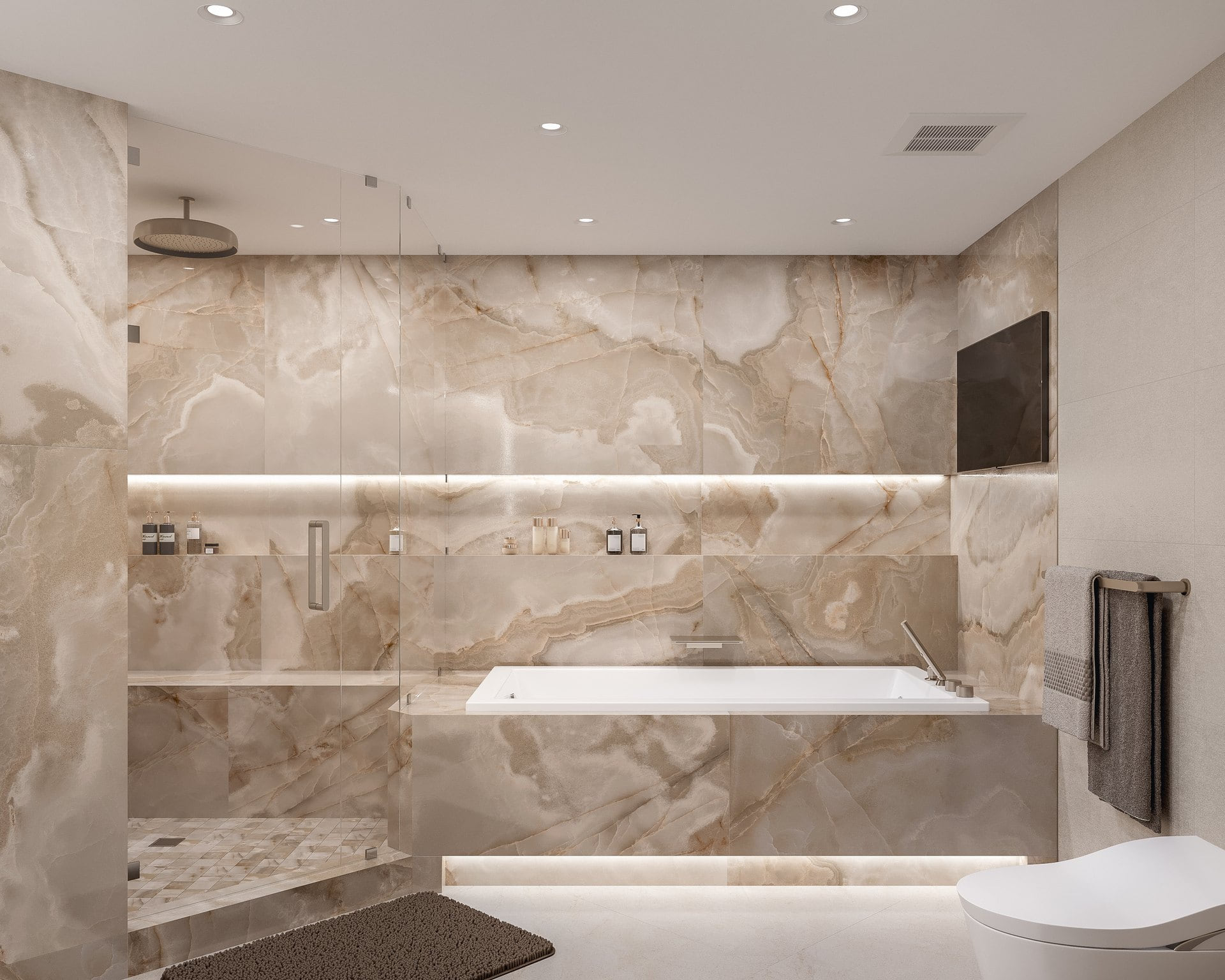 Frontal primary bathroom view with the tub on the right, glass shower on the left, and a long illuminated wall niche.