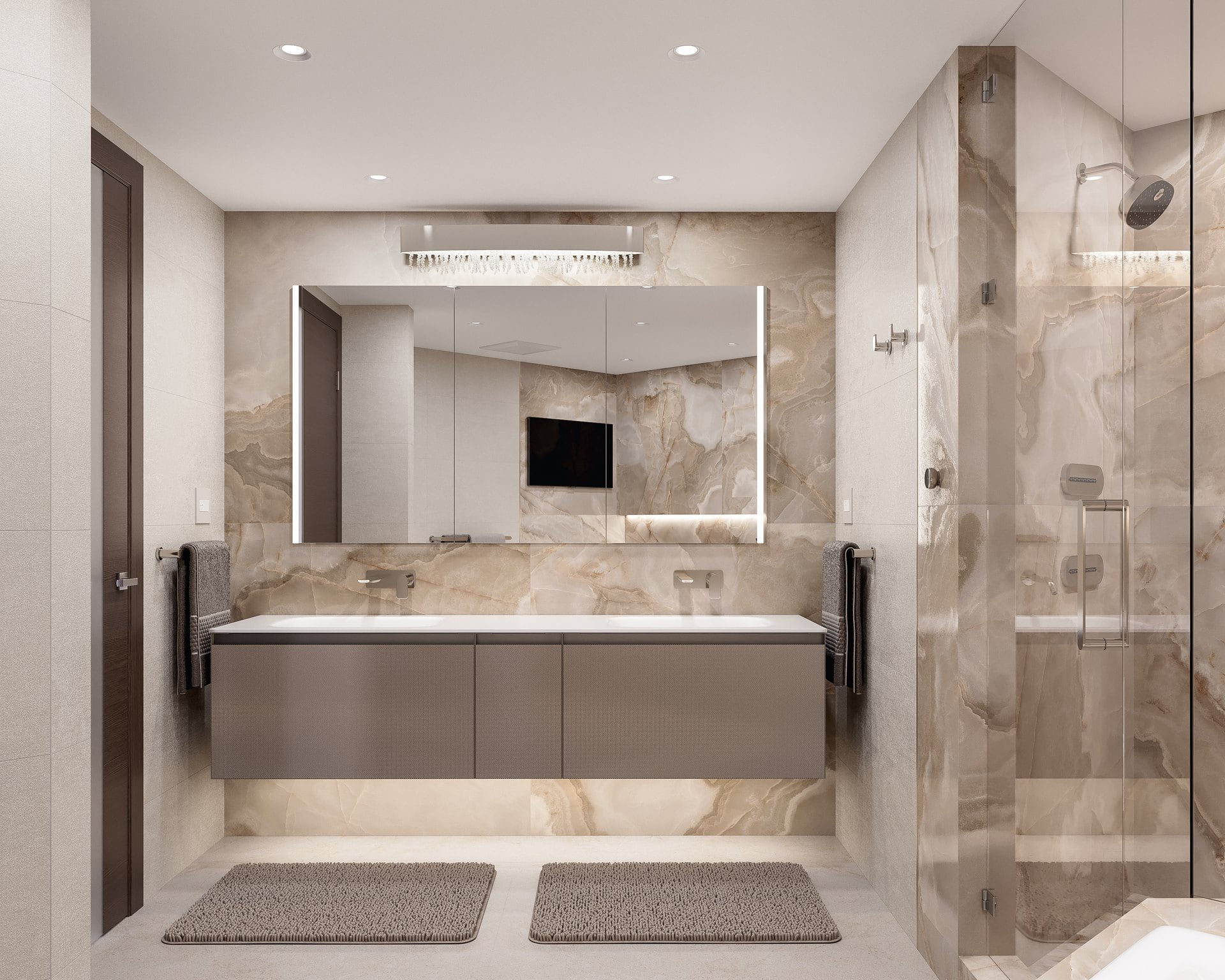 Closer view of the floating primary bathroom vanity and illuminated mirror.