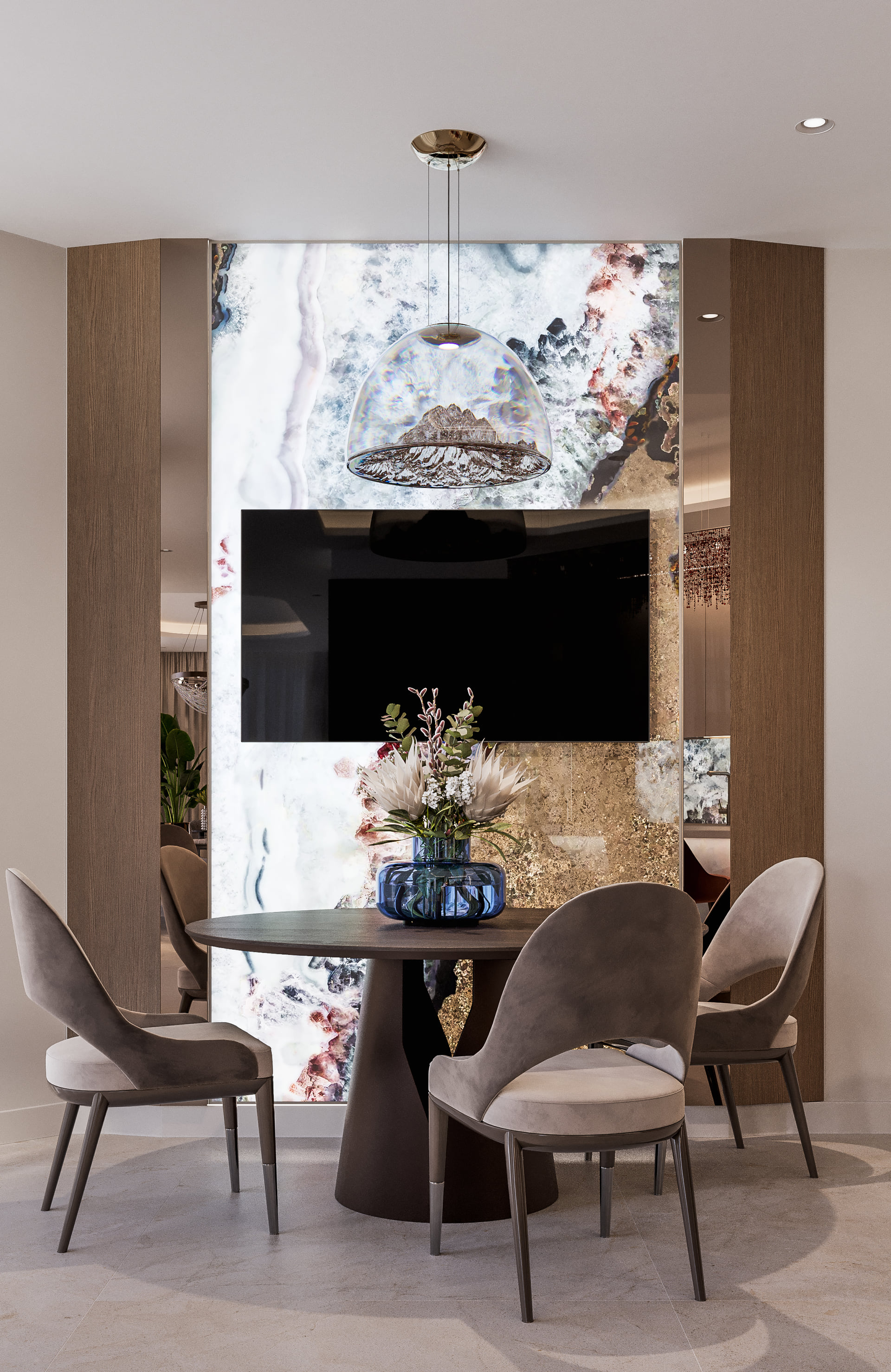 Breakfast area with a round table, upholstered chairs, glass pendant and illuminated feature wall.